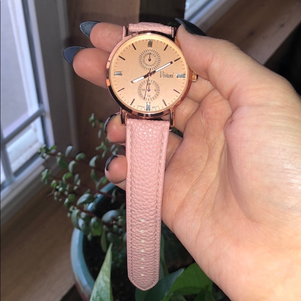 Pink/rose gold Vivani watch.
